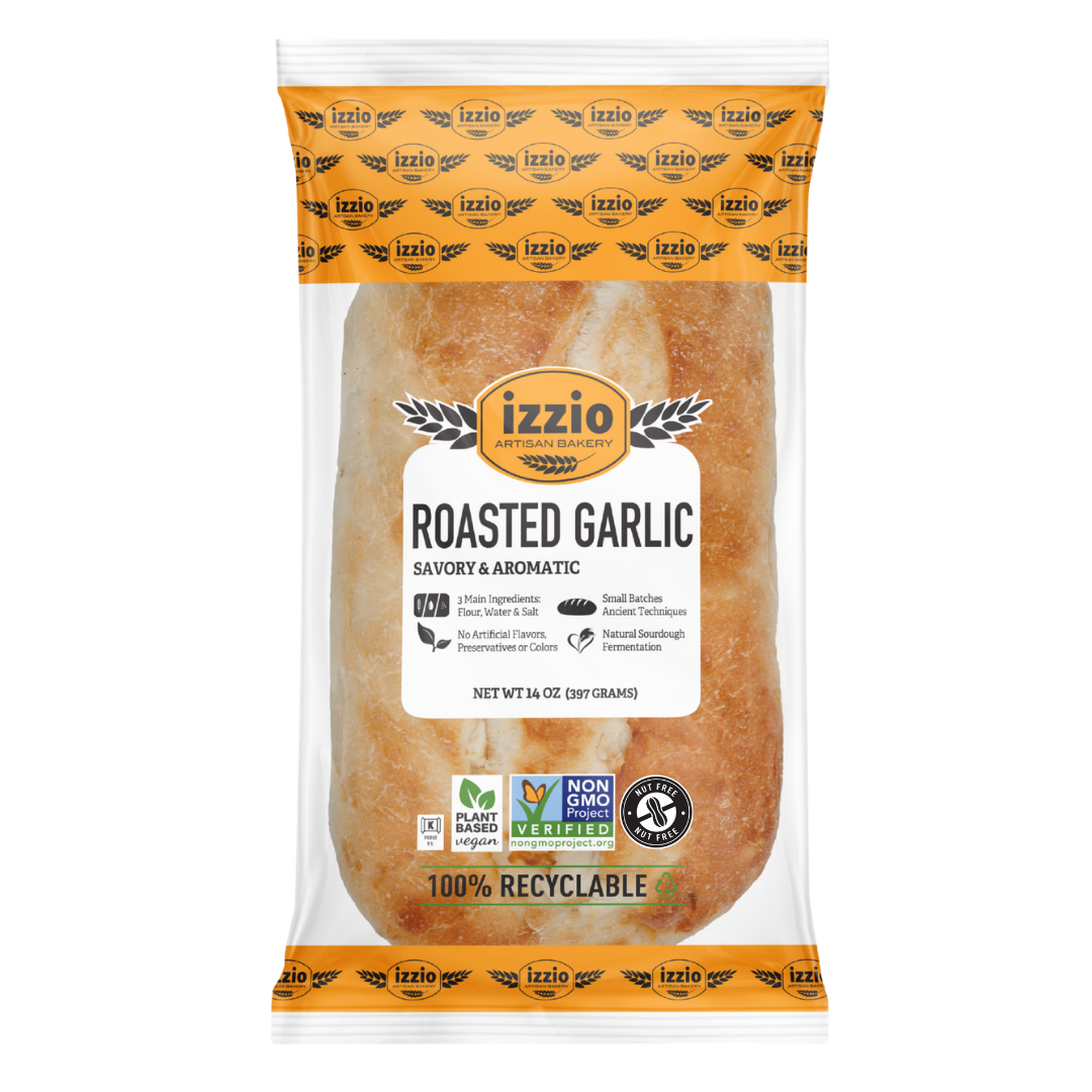 A 16 oz bag of Izzio Roasted Garlic, featuring a clear plastic package with a white and orange label, showcasing the golden-brown garlic inside.